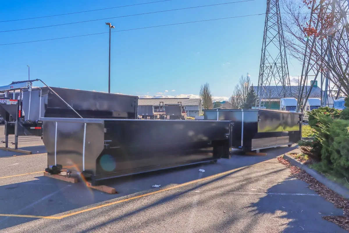 Roll-off dumpster ready for waste disposal at job site for 2 Yard Dumpster Rental in Gates